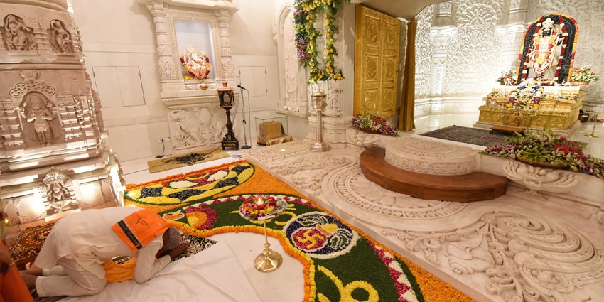 A person praying in a ram mandir, it is one of the things to do in lajpat nagar delhi